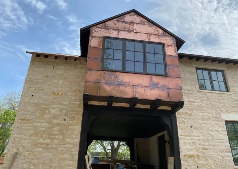 Copper metal panel facade on a stone building for Metal Roof Coating in Susanville
