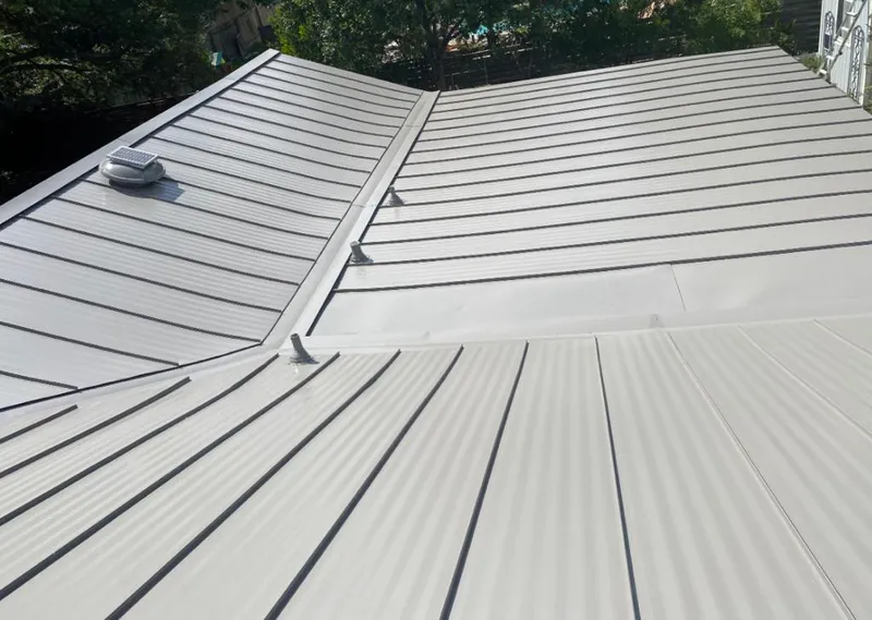 Solar attic fan installed on a metal roof for Roof Ventilation in Susanville